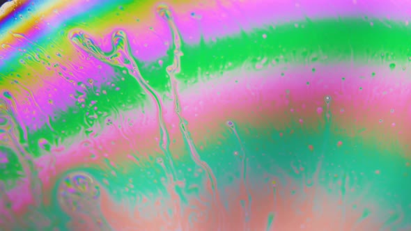 Abstract Multicolored Rainbow Liquid . Bunch of Bubbles Going Through Layers