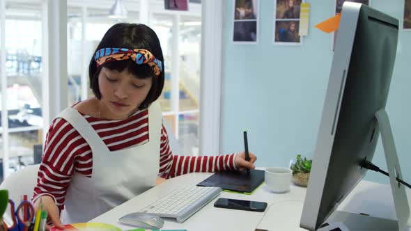 Young woman working in a creative office