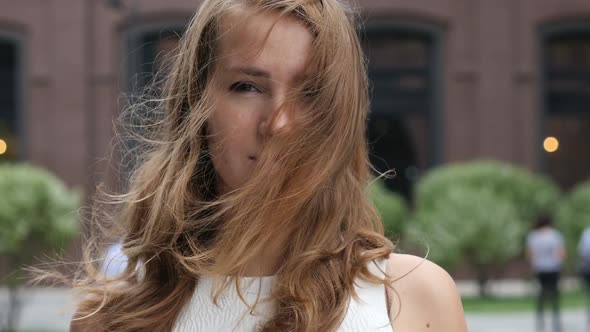 Flying Hairs in Wind of Beautiful young Girl, Outdoor