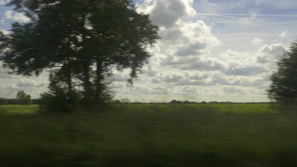 An amazing sight of dutch clouds in the skies over the countryside in the Netherlands, passing by, s