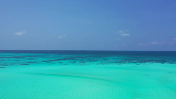 Aerial top down travel of beautiful tourist beach journey by clear lagoon with white sand background