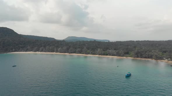 Wide view of Lazy Beach Shoreline under a cloudy golden hour in Koh Rong Sanloem, Cambodia 