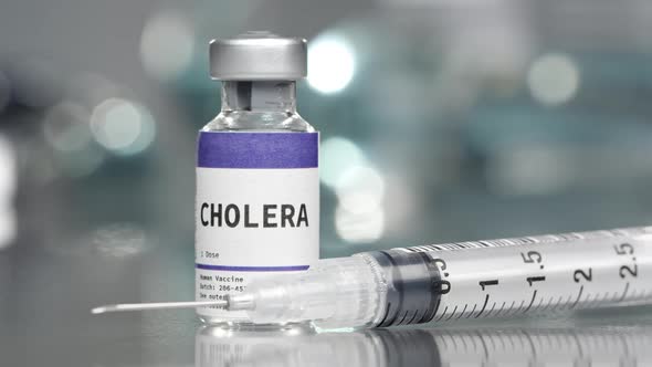 Cholera vaccine vial in medial lab with syringe
