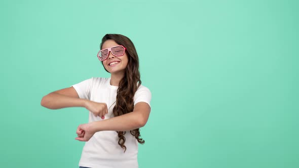 Happy Kid in Glamour Glasses Having Party Fun and Dancing Showing Peace Gesture Fashion Accessory