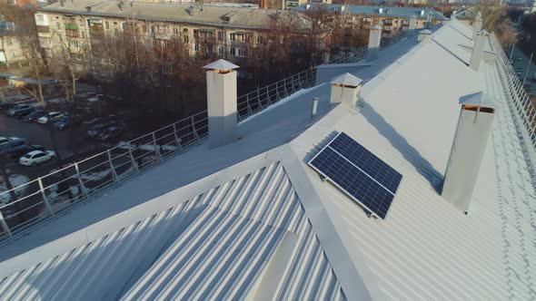 Mini Solar Energy Station on Roof of Old Apartment Building