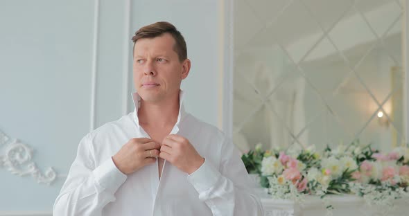 Groom Buttoned Shirt  Groom is Getting Ready for the Wedding