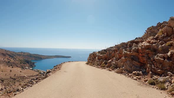 Vehicle POV drive. Car Travel point of view road to the mediterranean sea. Coastline nature