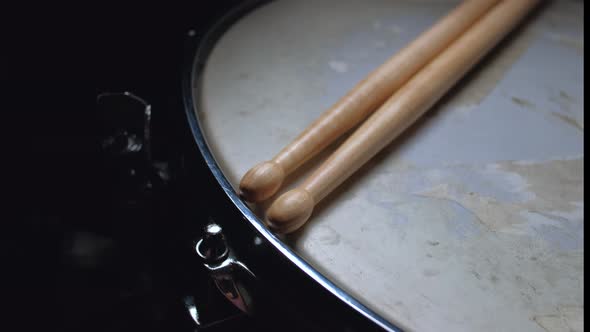 Drumstick Lying on a Drum Snare Close Up