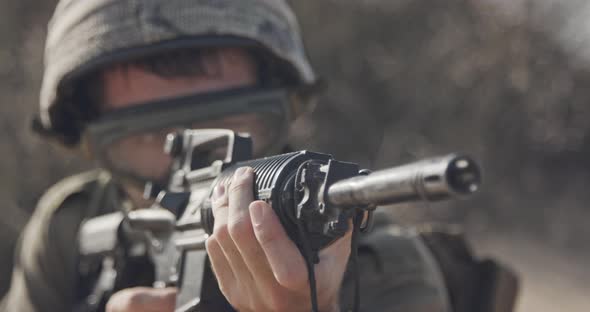 Close up of an Israeli soldier poiting his rifle looking for enemies