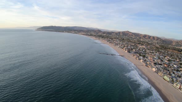 Flying Along Ventura California Usa Coast Above Beach And Waterfront Homes