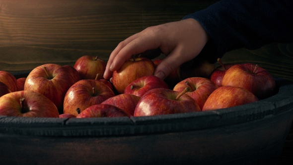 Person Takes An Apple From Barrel 2 Shots