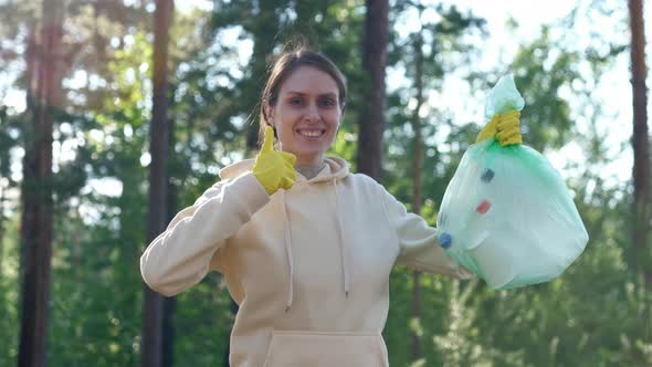 Positive Volunteer Female Raises Thumbs Up