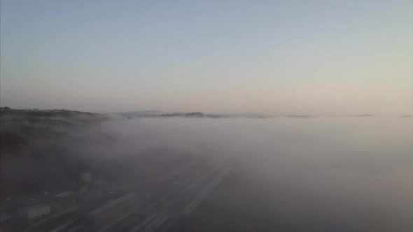 Sunrise Over  Brewster Train Station on a  Misty and Foggy Morning