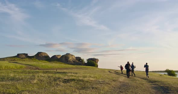 The Family is Walking in Nature