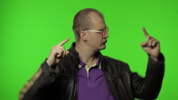 Playful Rocker Man in Pink Sunglasses Moving in Dance, Smiling, Making Dab Poses, Gesture of Success