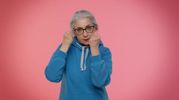 Aggressive Angry Senior Granny Woman Trying to Fight at Camera Shaking Fist Boxing Punishment