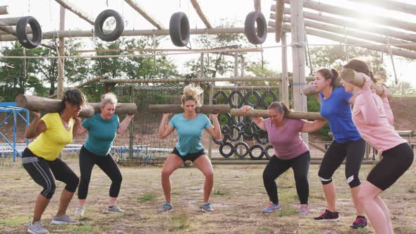 Female friends enjoying exercising at boot camp together