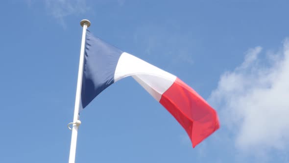 French flag in front of blue sky slow waving on wind 4K 3840X2160 UltraHD footage - Flag of France i