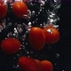 Closeup of Cherry Tomatoes Falling Into the Water in Slow Motion - VideoHive Item for Sale
