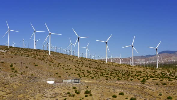 Pedestal Up Rising Aerial of Wind Turbines Producing Alternative Clean Energy