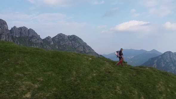 Man trekking on hiking trail, European Alps, Lecco, Italy