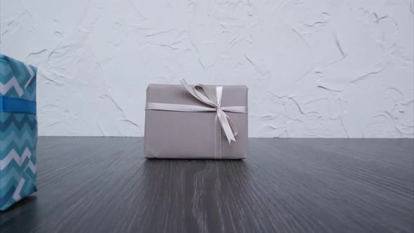Set of Gifts in Blue-Brown Wrappers Move Into the Camera. Stop Motion