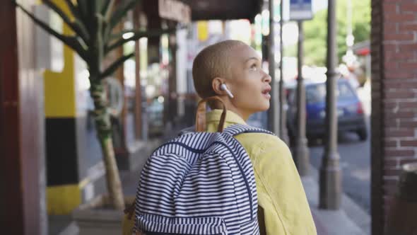 Mixed race woman walking on street