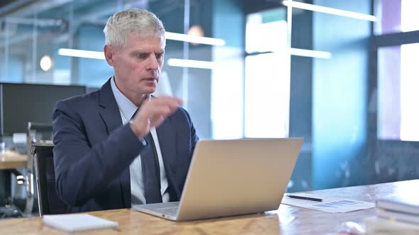 Tired Middle Aged Businessman Having Neck Pain on Office Desk