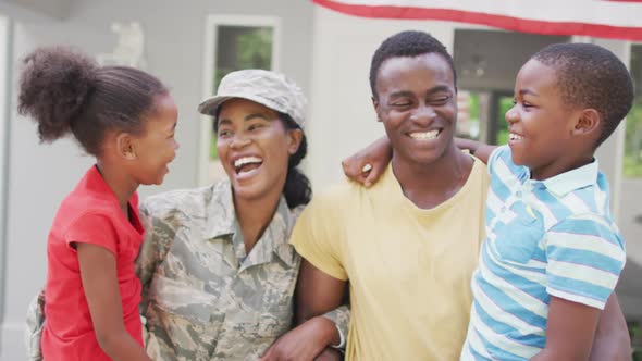 Animation of happy african american family welcoming soldier mother returning home