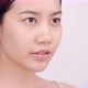 Slow motion of Asian girl with natural make up patting her face gently on white background. - VideoHive Item for Sale