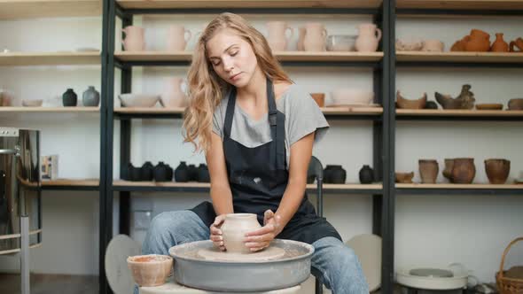 Pottery Workshop Young Female Potter Makes a Pitcher Out of Clay Handicraft Production of Handmade