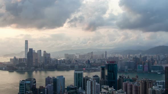 Timelapse Hong Kong on Wide Harbor Banks Against Hills