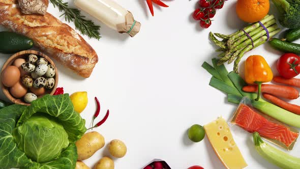 Healthy food background. Different fruits and vegetables on white background. Vertical footage.