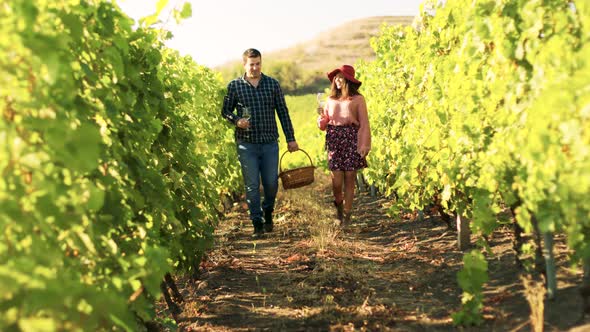 Beautiful Caucasian Couple with Glasses of Wine in Hands