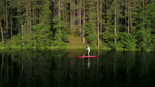 Woman Paddling Stand Up Paddle Board