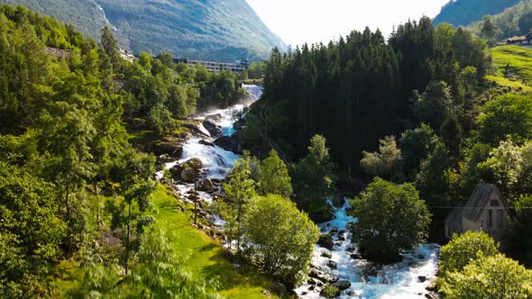 River Geirangerelvi and the waterfall Storfossen in Geiranger, Norway