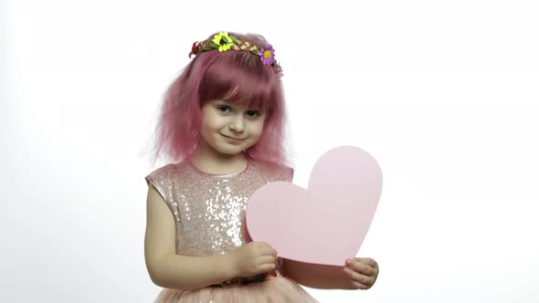 Child Girl Princess Holds Pink Paper Heart. Mothers Day, Valentines Day Concept