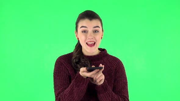 Girl Asks for Information on the Network Via Phone on Green Screen