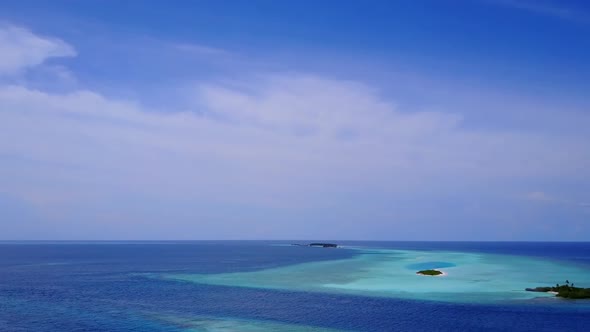 Drone view scenery of island beach time by water with sand background