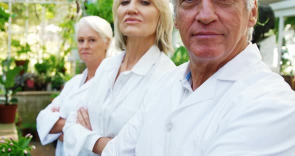 Portrait of scientists standing with arms crossed