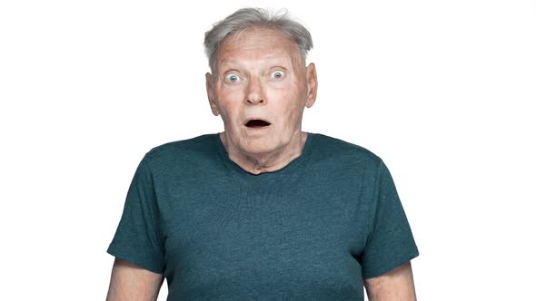 Portrait of Uptight Mature Pensioner 80s Having Gray Hair in Casual Wear Reacting with Open Mouth on