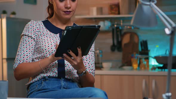 Lady Writing Next Tasks on Tablet