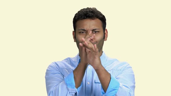 Young Man Making Funny Face on White Background