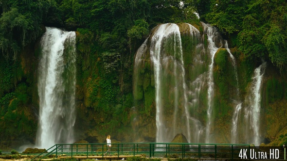 4K Woman Walking in Front of Bao Gioc Waterfall in Cao Bang, Vietnam