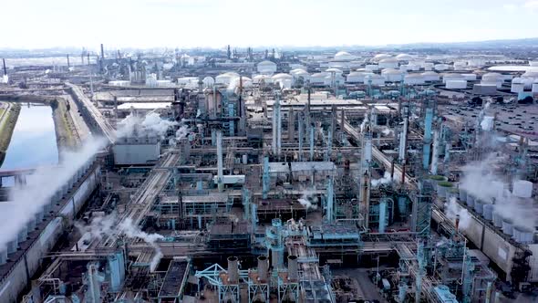 Aerial Drone Footage of Petroleum Refinery and Trucks in Industrial Area of the United States