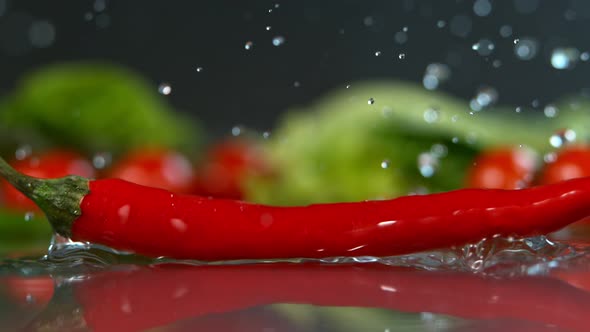 Chilli Falling to Water in Super Slow Motion Shot with High Speed Cinema Camera in   1000Fps