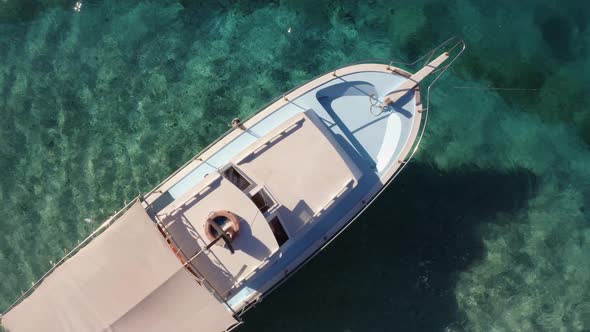 Aerial View of White Boat on Turquoise Ocean Water