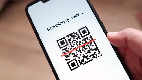 Scanning QR Code By Smartphone Bar Code Reader Using Application on Smartphone Screen