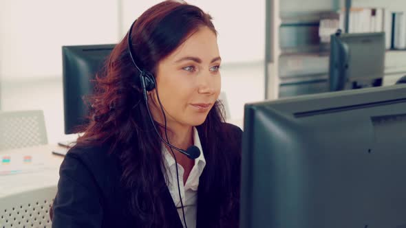 Business People Wearing Headset Working in Office