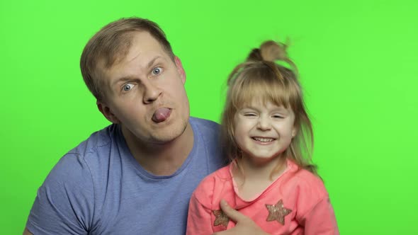 Father and Little Daughter Making Faces To Camera. Chroma Key. Fathers Day